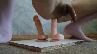 The boy stretches his ass with two dildos. Gets orgasm